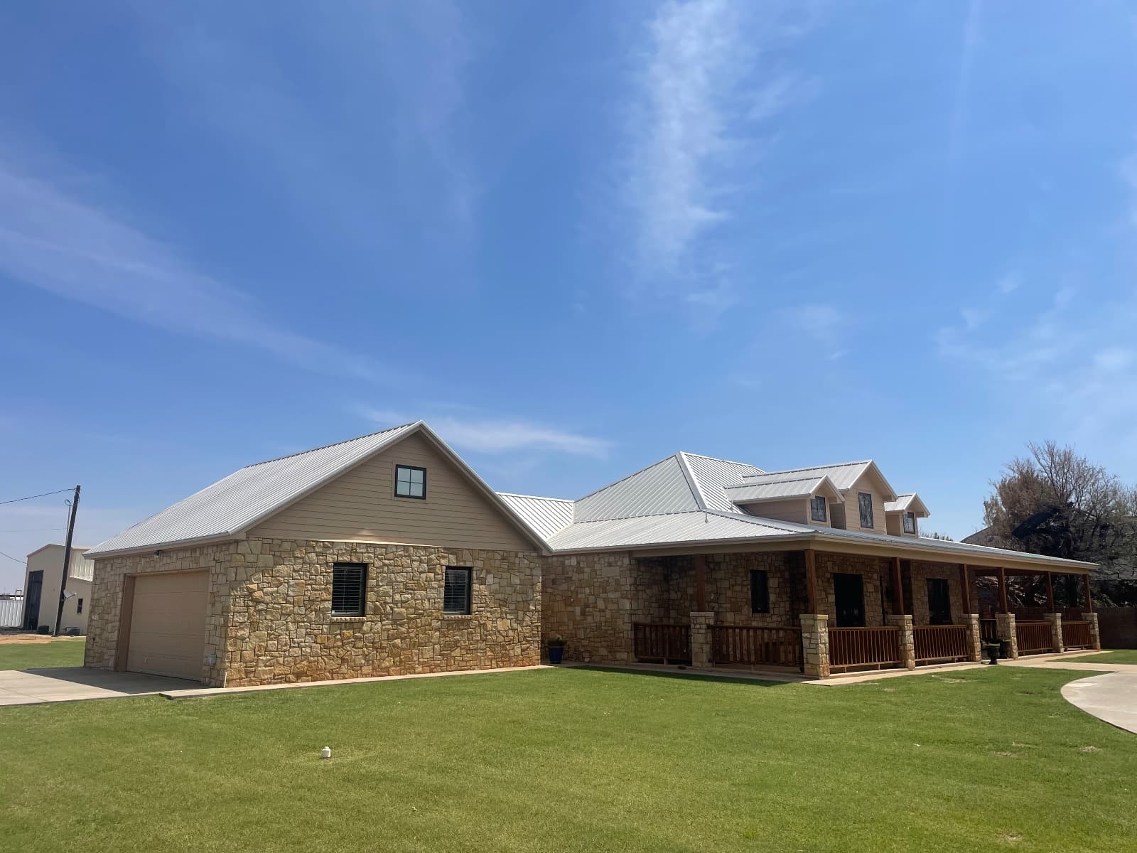 Fascia, soffit, and garage doors repainted by Luxeline Painters of Lubbock