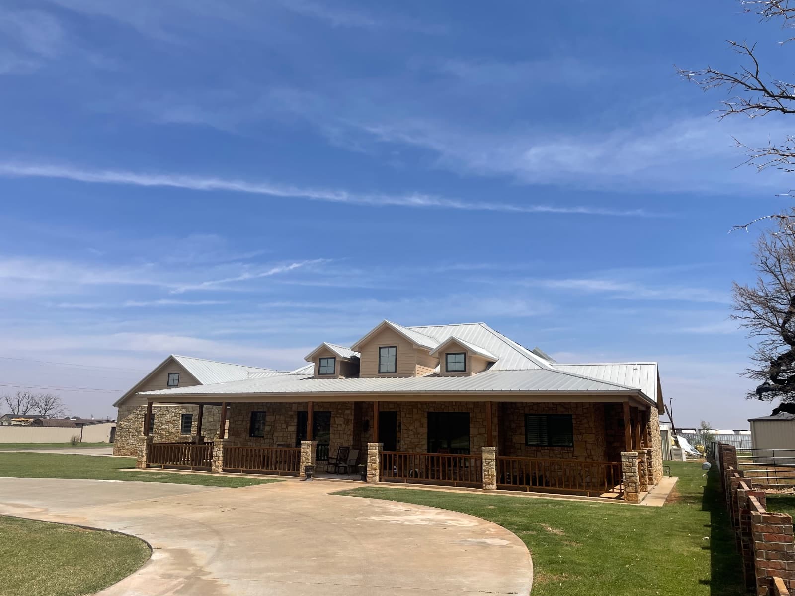 Fascia, soffit, and garage doors repainted by Luxeline Painters of Lubbock